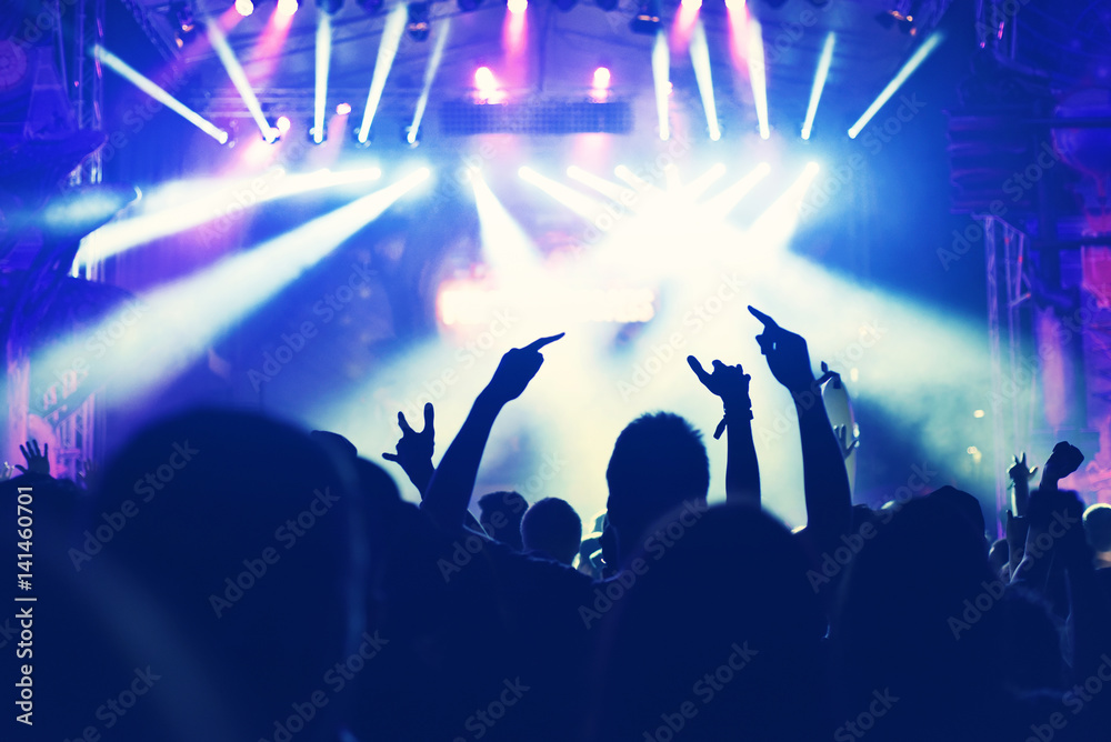 Crowd with arms outstretched at concert Crowd with arms outstretched at concert