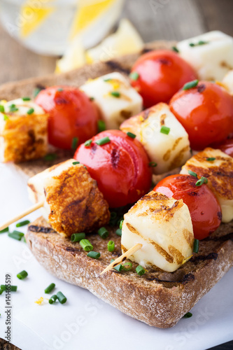 Open grilled haloumi kebab sandwich with tomato