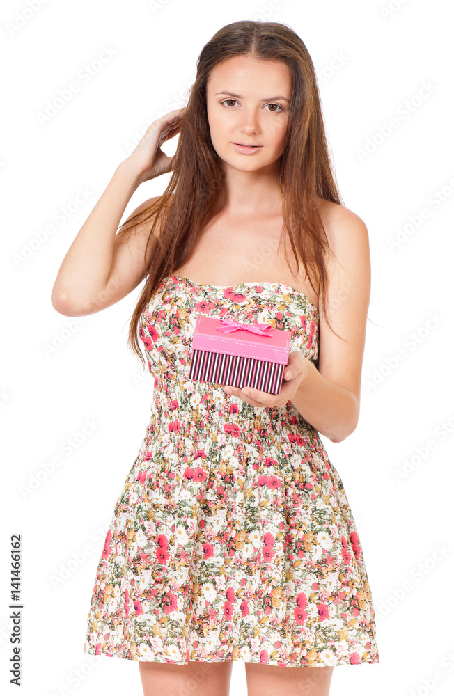 Portrait of a smiling cute teen girl with gift box and looking at camera, isolated on white background Portrait of a smiling cute teen girl with gift box and looking at camera, isolated on white background