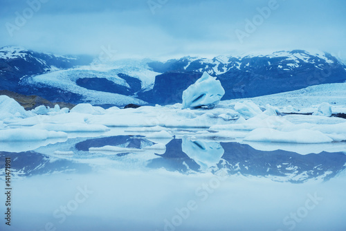 Jokulsarlon glacier lagoon, fantastic sunset on the black beach, Iceland