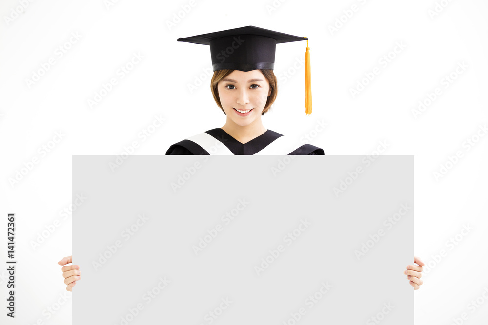Graduate student girl showing blank placard board Graduate student girl showing blank placard board