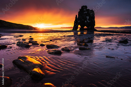 Hvitserkur 15 m height. Is a spectacular rock in the sea on the Northern coast of Iceland. this photo reflects in the water after the midnight sunset.