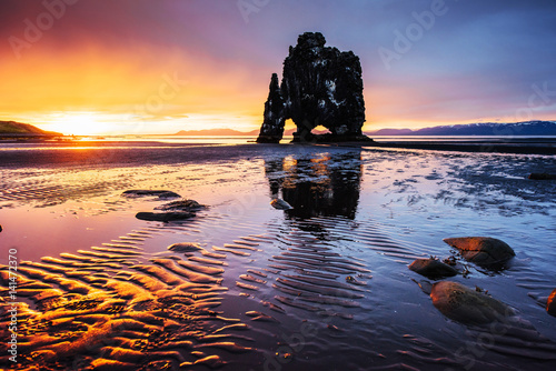 Hvitserkur 15 m height. Is a spectacular rock in the sea on the Northern coast of Iceland. this photo reflects in the water after the midnight sunset.
