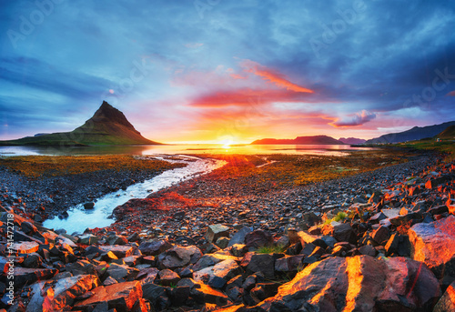 The picturesque sunset over landscapes and waterfalls. Kirkjufell mountain Iceland