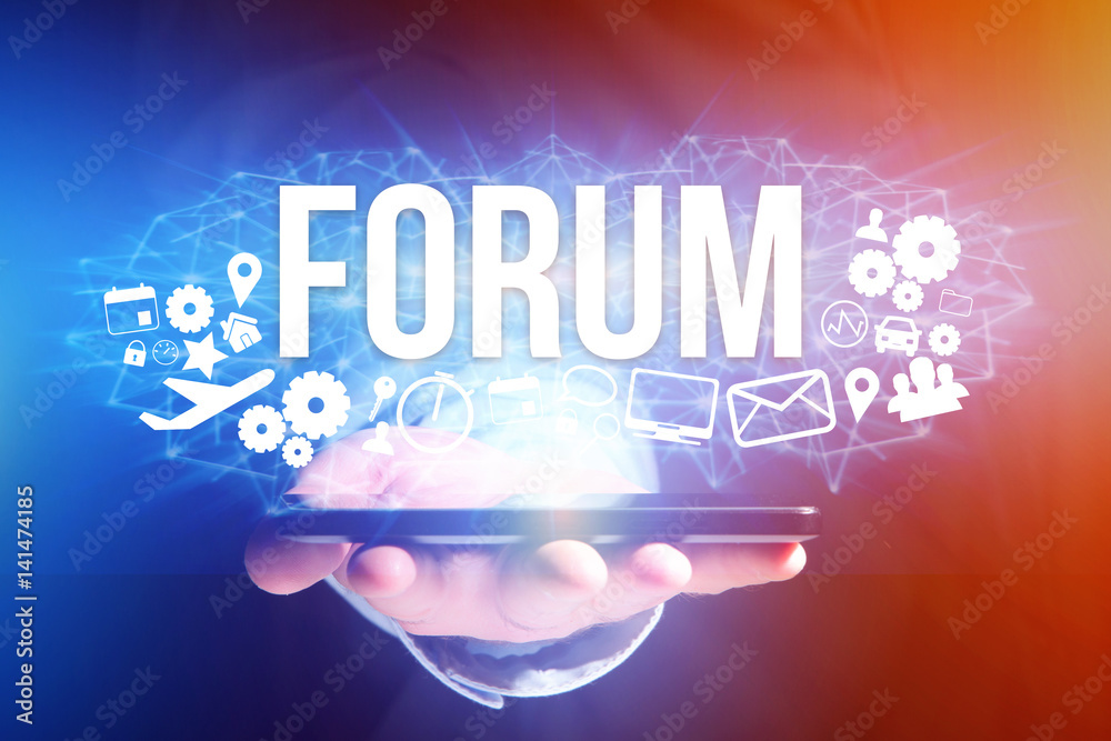 Concept of man holding futuristic interface with forum title and multimedia icons flying all around - Internet concept Concept of man holding futuristic interface with forum title and multimedia icons flying all around - Internet concept