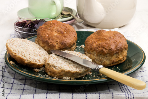 Tableau sur toile british wheaten scone with butter on a plate