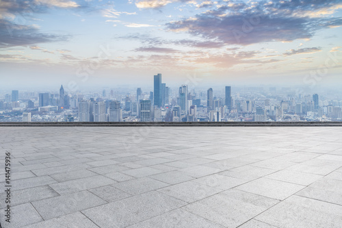 Panoramic skyline and buildings with empty concrete square floor