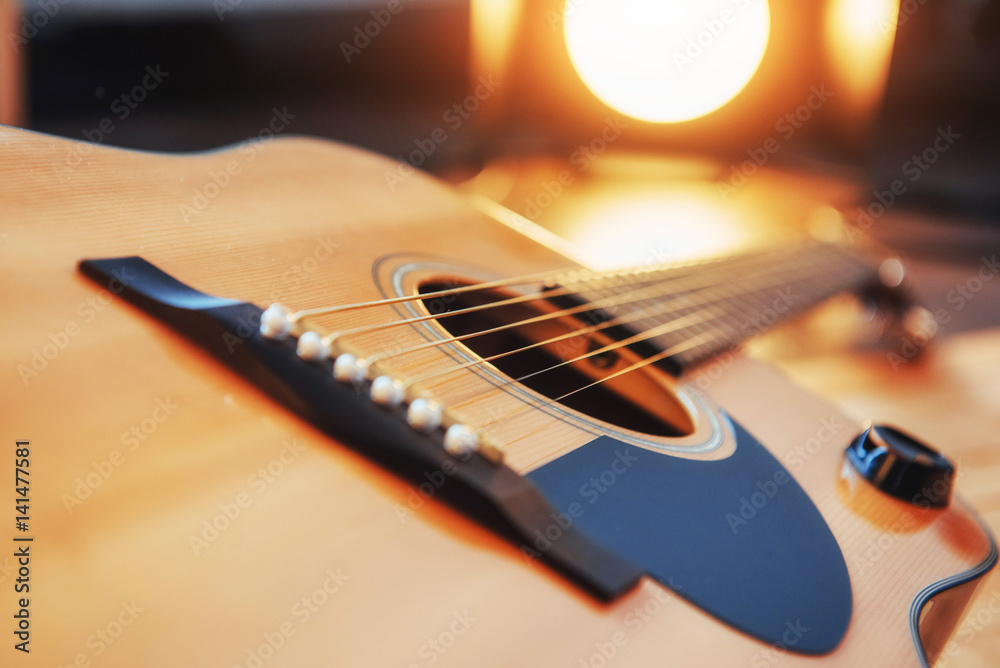 Fototapeta premium detail of classic guitar with shallow depth of field