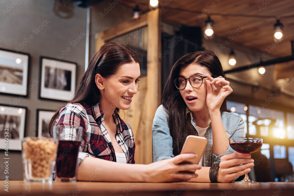 Attractive female looking at her best friend Attractive female looking at her best friend