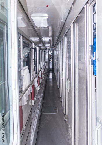 Corridor of a sleeping railway car of an intercity train. Russia