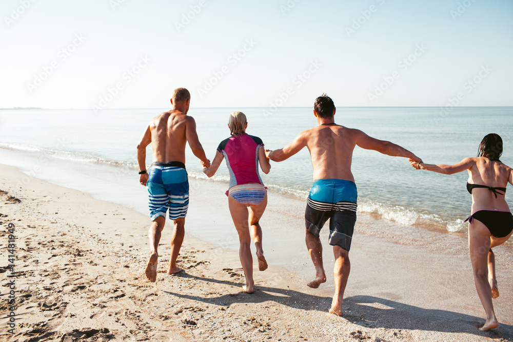 Friends on the beach. Have fun at sunny summer day