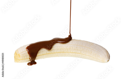 Peeled banana doused with liquid chocolate isolated on white background