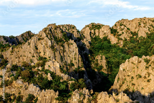 Steep rock mountains with high peak in the national park in Thailand. © fasndee