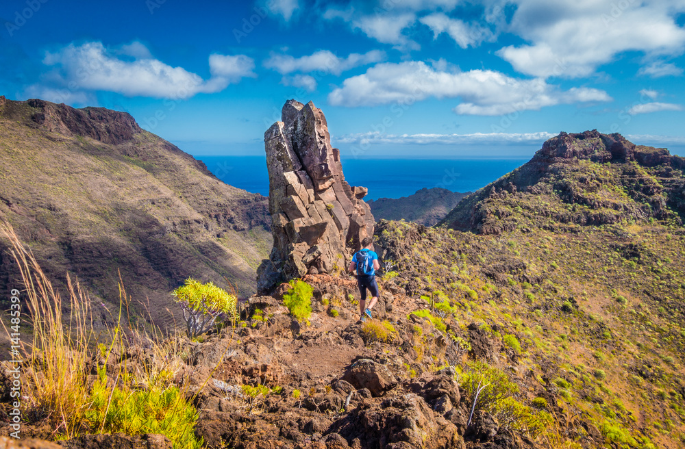 Hiker on a trail in the Canary Islands, Spain