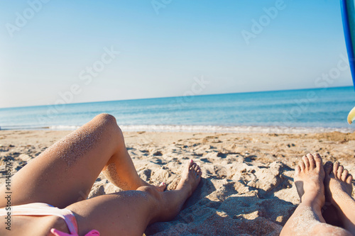 Womans legs on the sand © Kirill Grekov