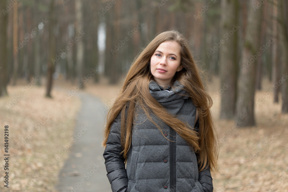 Portrait of a girl in a gray jacket in the open air Portrait of a girl in a gray jacket in the open air
