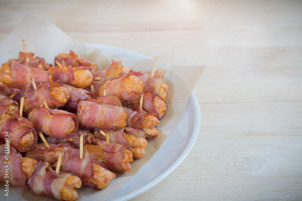 Deep fried sausages rolled in bacon Deep fried sausages rolled in bacon