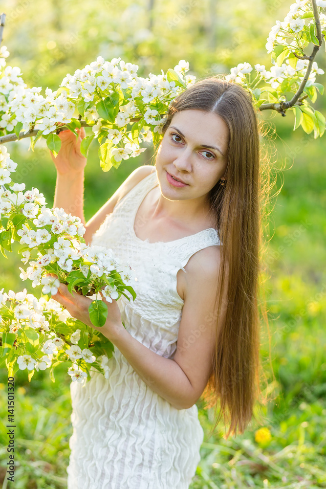 Portrait of a beautiful young woman in the rays of the setting sun Portrait of a beautiful young woman in the rays of the setting sun