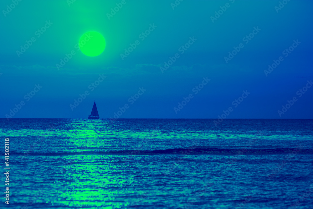 Naklejka premium Early morning, blue sunrise over sea. Sailboat on horizon