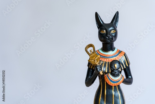 The Goddess Bastet - Role in ancient Egypt on gray background. 
Bastet was a goddess in ancient Egyptian religion.  photo