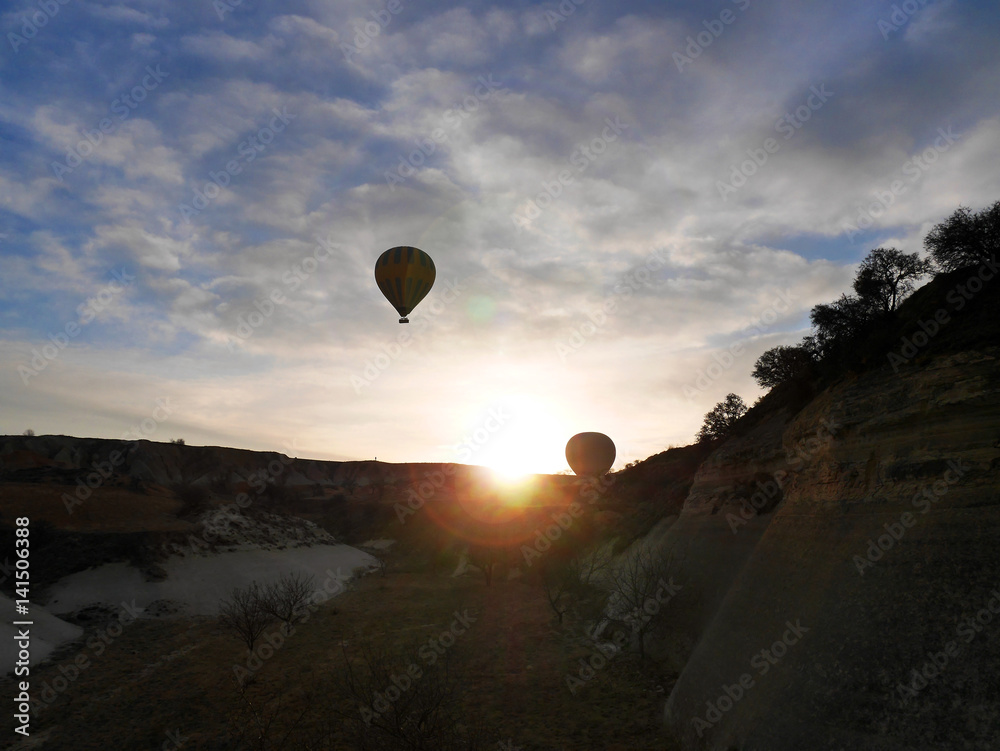 CAPPADOCIA, TURKEY - March 9, 2017: Two balloons taking off at sunrise