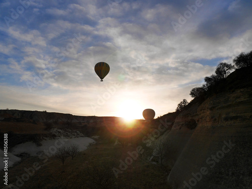 CAPPADOCIA, TURKEY - March 9, 2017: Two balloons taking off at sunrise