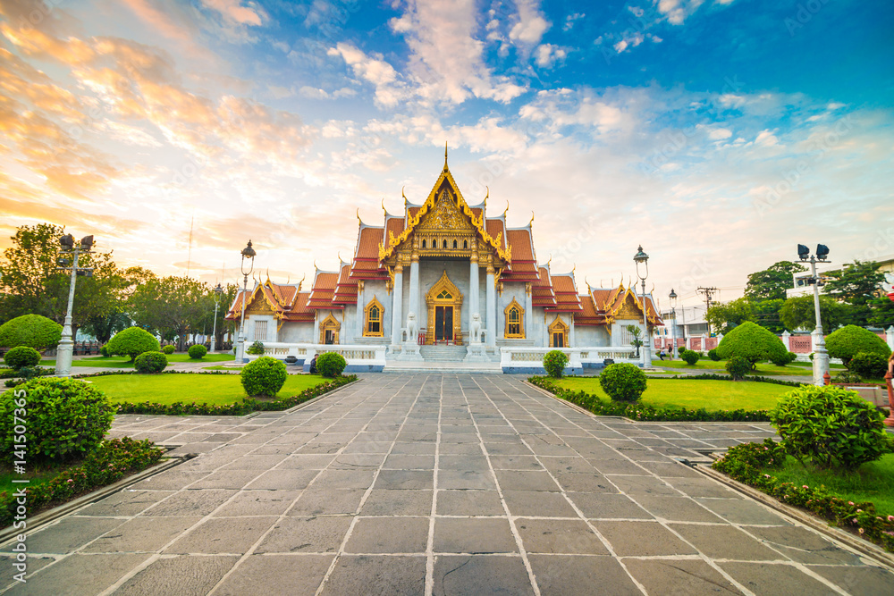 Naklejka premium The marble buddha temple Wat Benchamabopit Dusitvanaram sunset