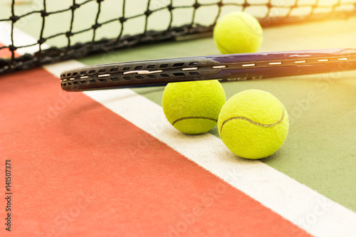 Tennis Ball with Racket on the racket in tennis cou © smolaw11