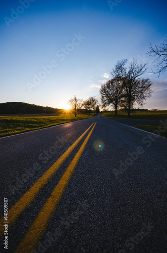 The road and the setting sun
