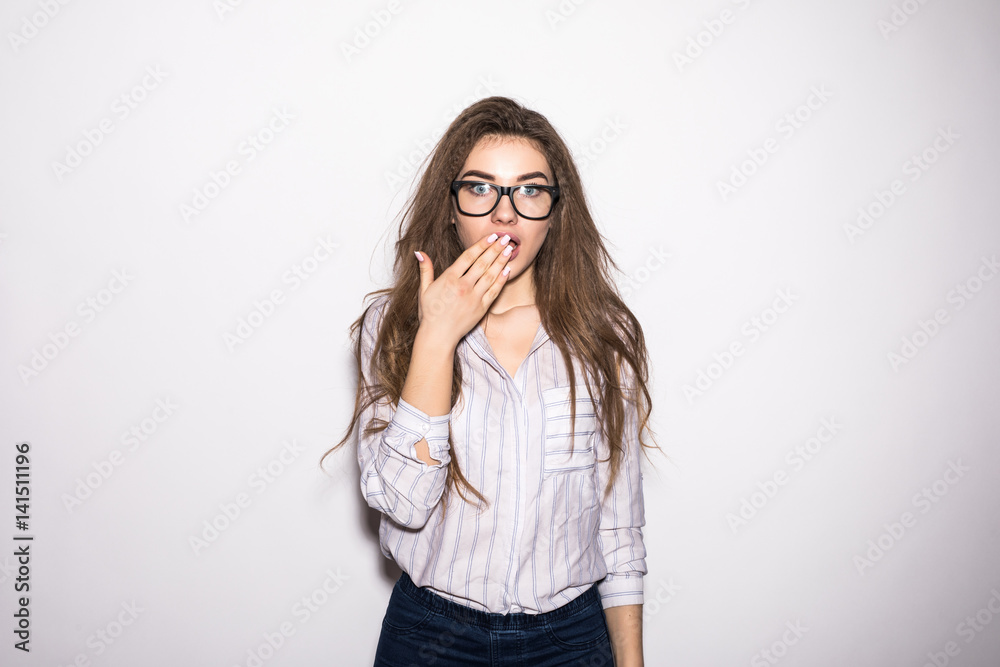 Surprised woman hands on her mouth in surprise. Woman shocked looking at the camera Surprised woman hands on her mouth in surprise. Woman shocked looking at the camera