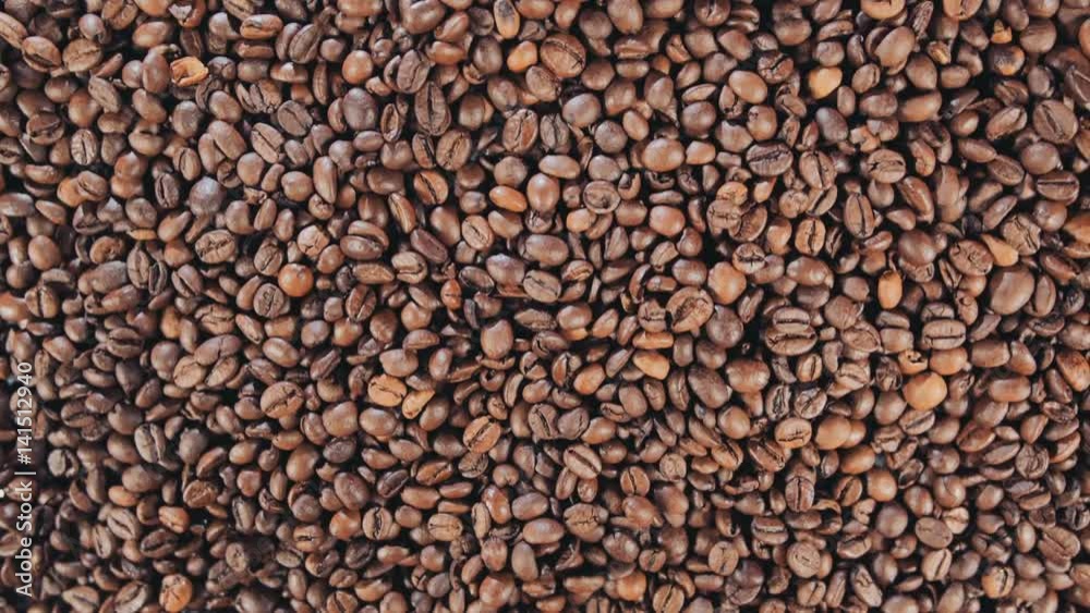Coffee beans are on the table. Rotate. Slow motion. Coffee beans are on the table. Rotate. Slow motion.