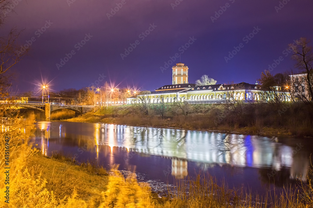 Night landscape of the city with a view of the river and the bridge. Vologda. Russia