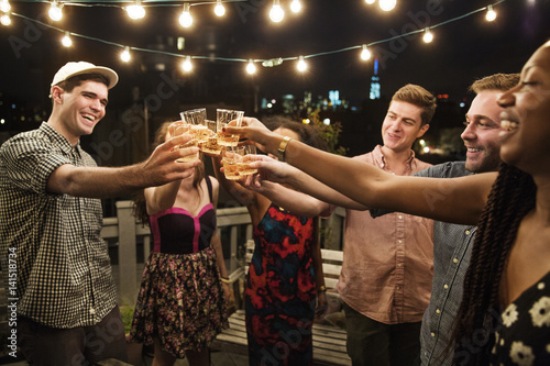 Young people raising toast at party photo