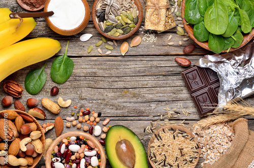 Healthy food, products containing magnesium on wooden background. Copyspace background.Top view.