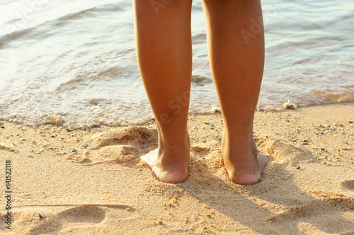 Girl standing on the beach