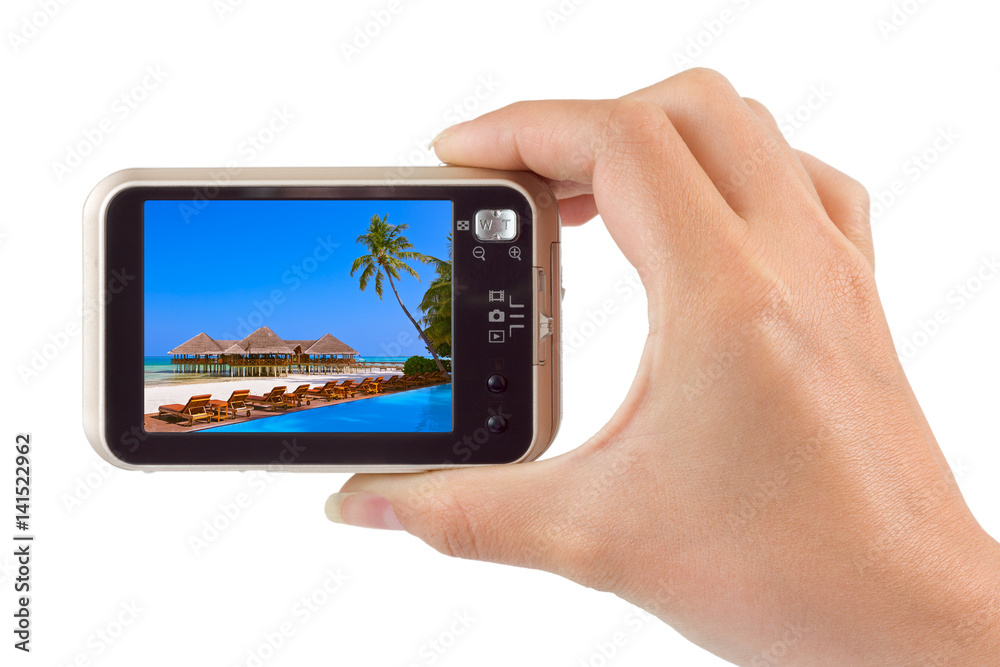 Hand with camera and Maldives beach photo (my photo)