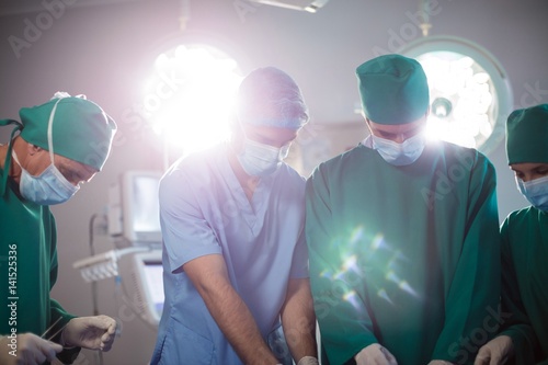 Medical team performing operation in a operating room