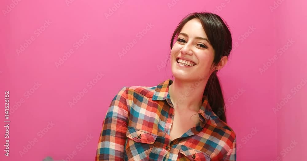 Woman laughing and tilting her head back