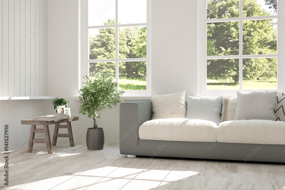 Fototapeta premium White room with sofa and green landscape in window. Scandinavian interior design. 3D illustration