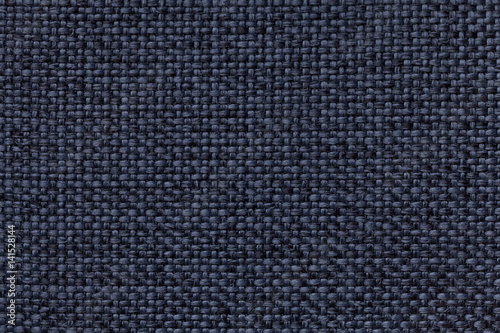 Blue background with braided checkered pattern, closeup. Texture of the weaving fabric, macro.