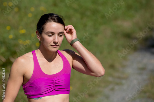 portrait of young sporty woman in the countryside