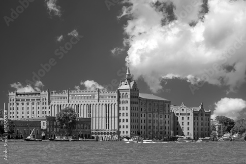 Beautiful view of the famous Molino Stucky overlooking the Giudecca canal, Venice, Italy, against a beautiful sky, in black and white