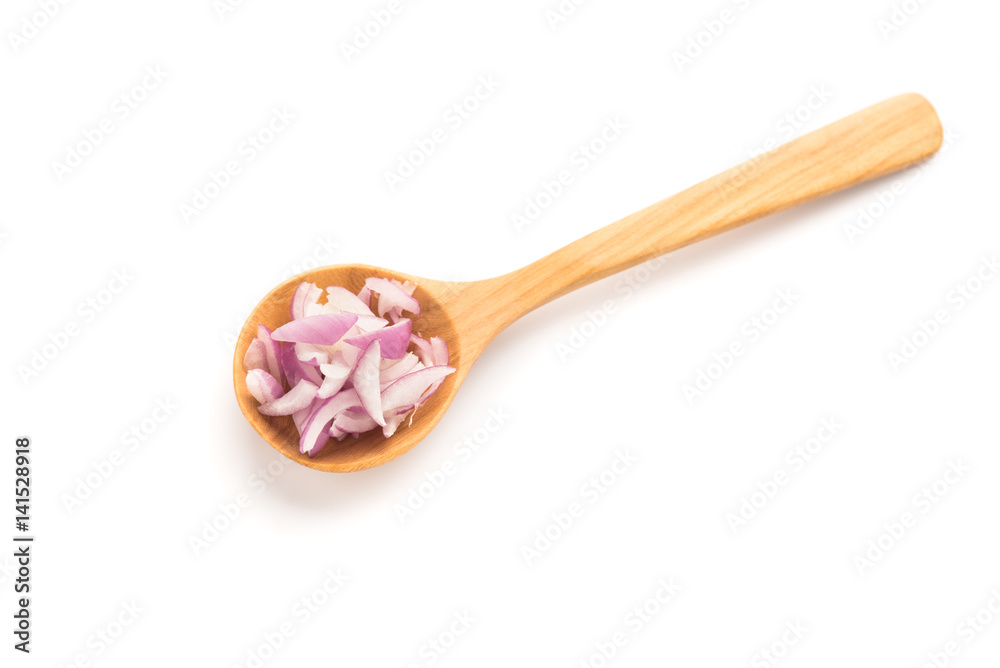 Red onion in wooden spoon on white background. Red onion in wooden spoon on white background.