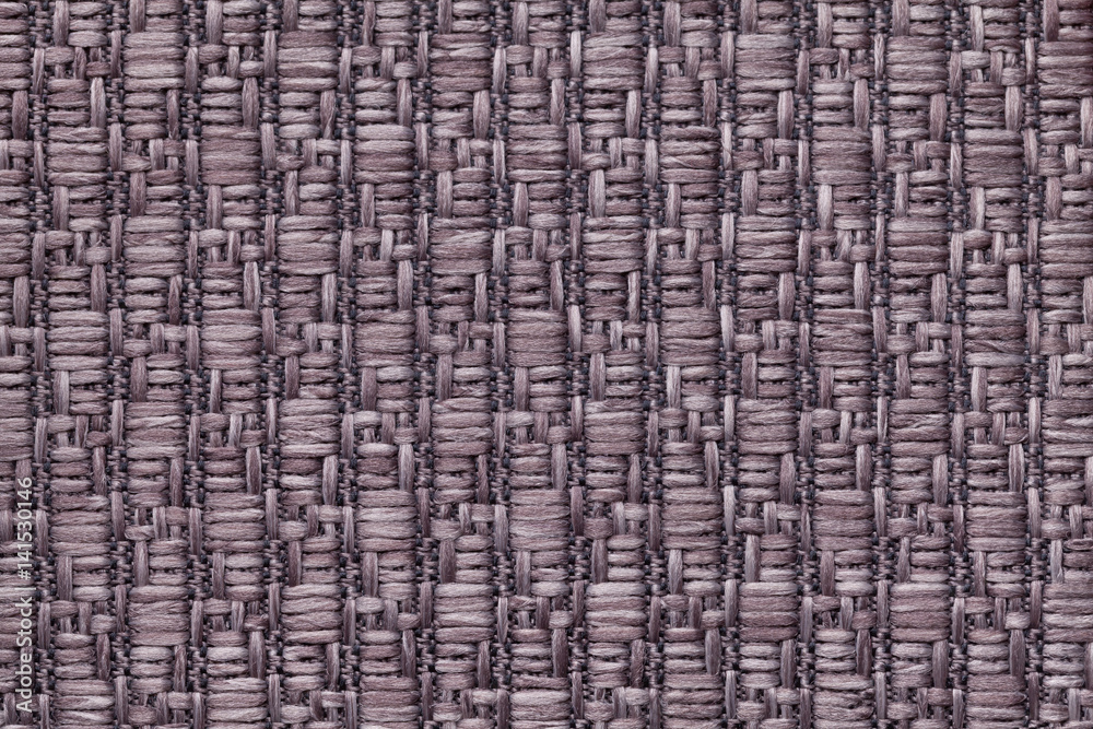 Brown knitted woolen background with a pattern of soft, fleecy cloth. Texture of textile closeup. Brown knitted woolen background with a pattern of soft, fleecy cloth. Texture of textile closeup.