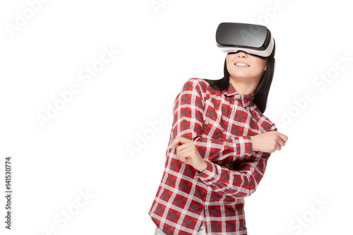 Smiling emotionally girl dancing in virtual reality.