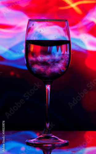 Wine glass on colourful background