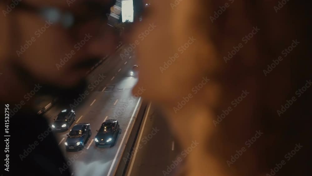 Couple on the bridge in the night . Couple on the bridge in the night .