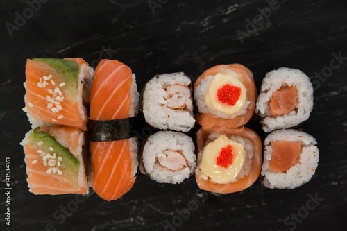 Maki, uramaki and nigiri sushi served in slate 