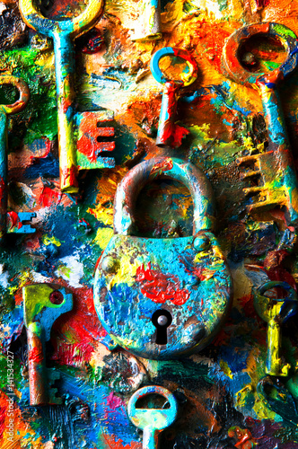 Keys and padlock on colorful abstract background