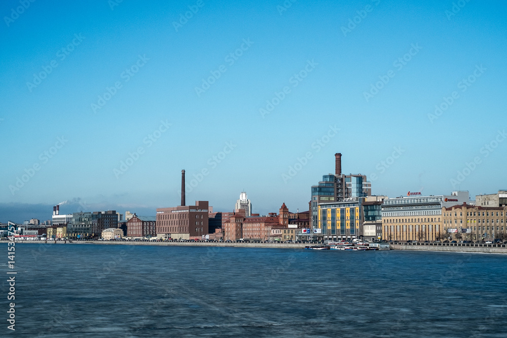 Saint Petersburg, Russia, 03/05/2017 - Industrial winter view with frozen Neva river